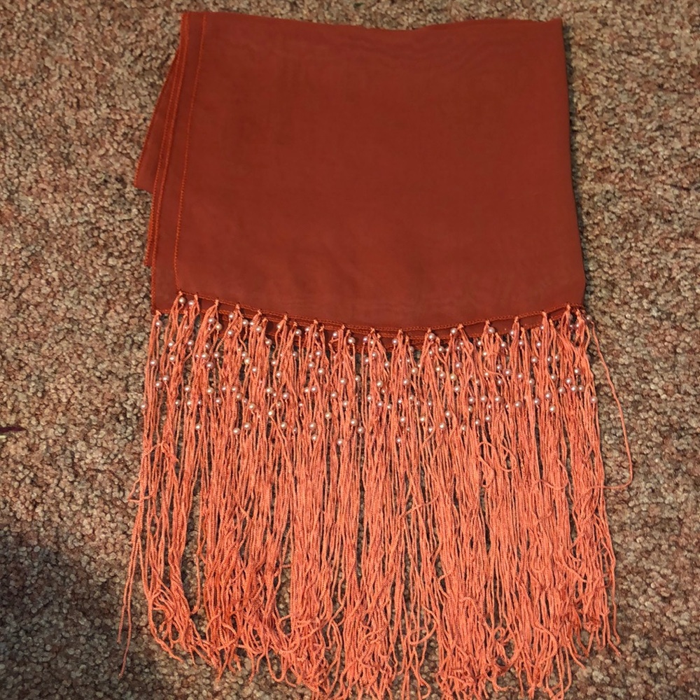 A dark pink-orange scarf